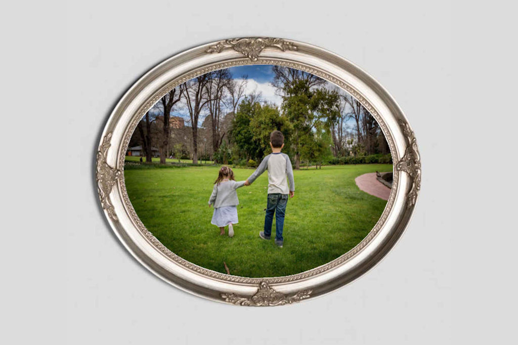 Oval Silver frame around a photo of Brother and Sister Oval Silver frame around a photo of Brother and Sister